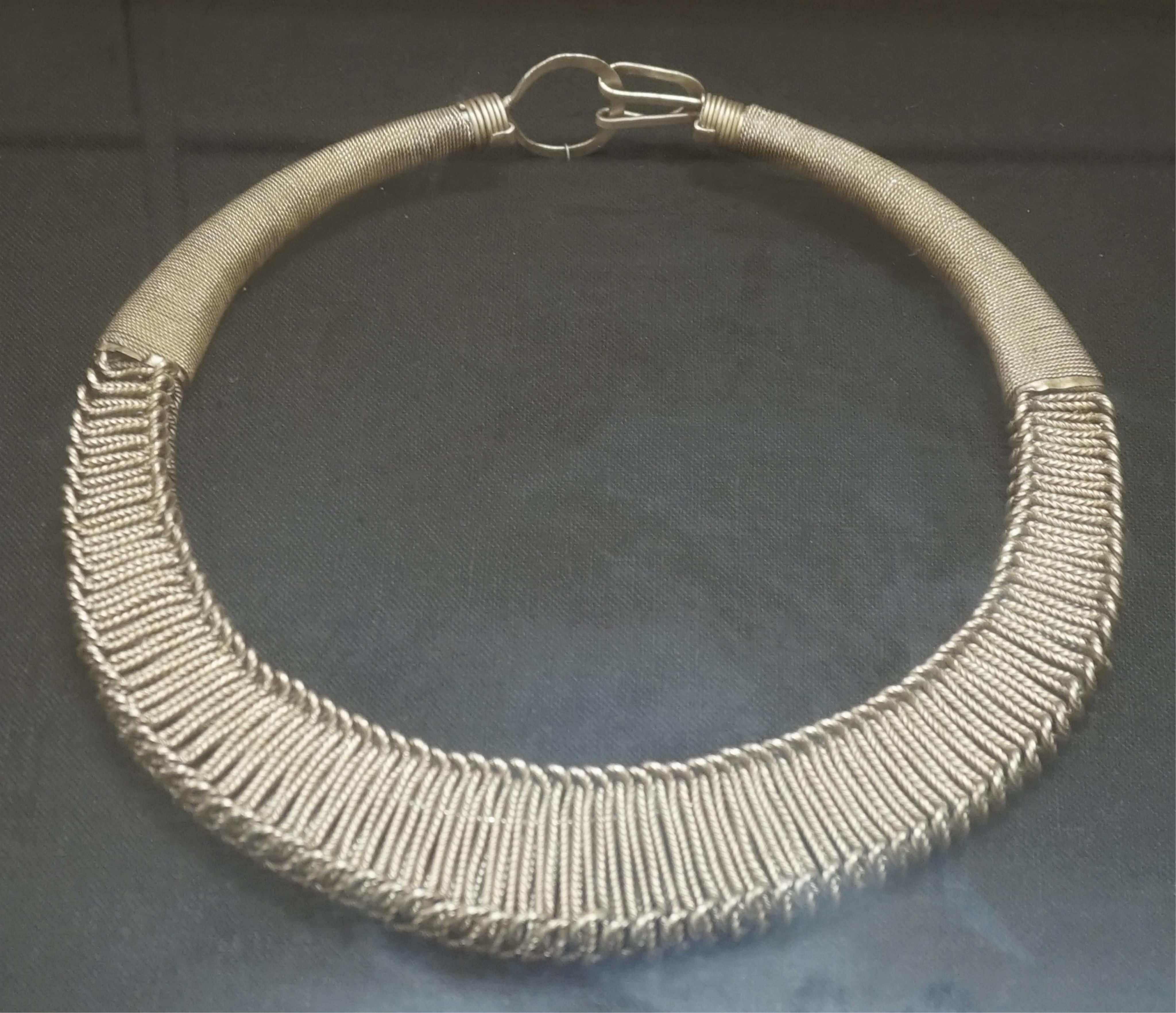 Two Chinese Miao framed white metal necklaces, frames 55cm sq. condition - fair to good